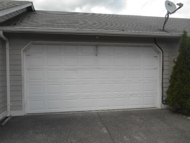 Where can you find the serial number and model of your residential garage  door opener?